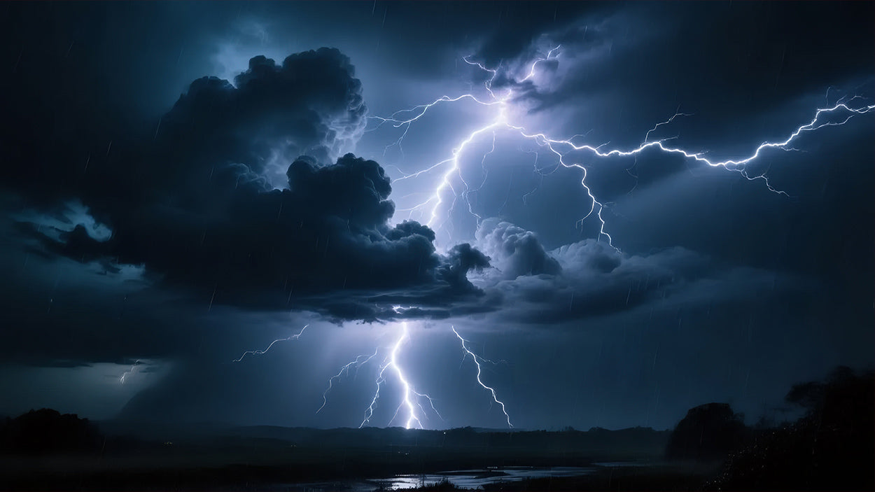 Dramatic lightning storm at night with multiple lightning bolts striking over dark landscape and stormy clouds