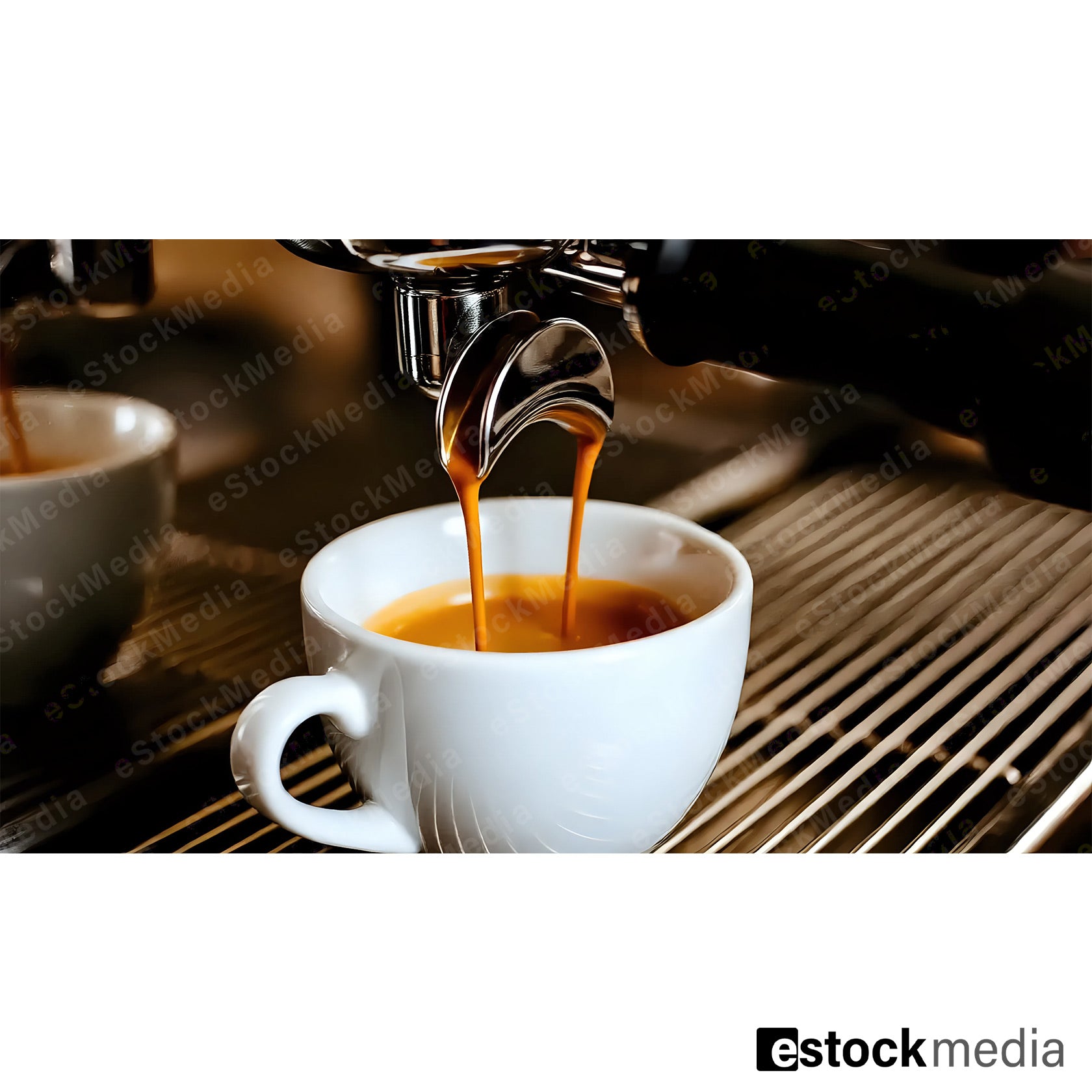 Close-up of espresso pouring into a white cup from an espresso machine.